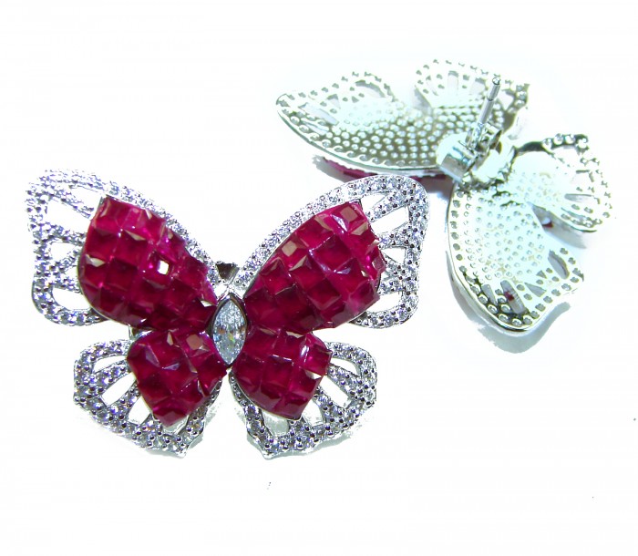 Real Beauty natural 18.9 carat Ruby Butterflies .925 Sterling Silver Large handcrafted earrings - Close-up of ruby butterfly brooches with diamond accents, top view.