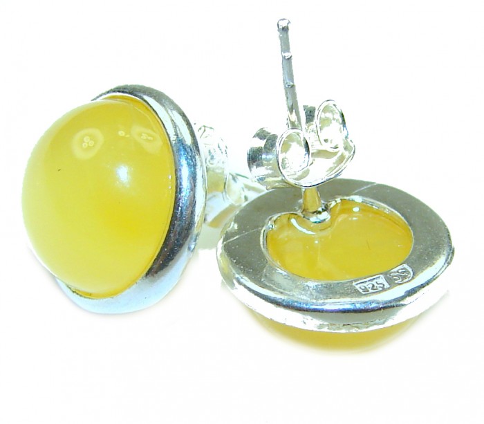 Natural Amber .925 Sterling Silver handmade earrings - Close-up of natural amber and silver earrings, showing front and back.
