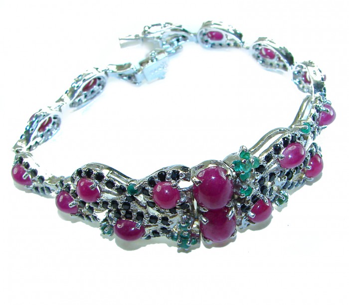 Gabriella 49.5 carat Genuine Ruby Emerald Sapphire .925 Sterling Silver handcrafted Bracelet - Ruby and emerald bracelet, top view, showcasing gemstones and silver setting.