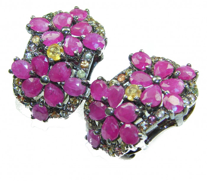 Bella Rosa Genuine 22.8 carat Ruby .925 Sterling Silver dipped in black rhodium Statement brilliantly handcrafted earrings - Ruby flower earrings, close-up, silver setting, vibrant stones.
