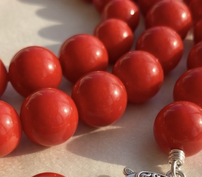 Konstancia Sublime natural Red Fossilized Coral Sterling Silver handmade Necklace - Close-up of red fossilized coral beads with metal detail.