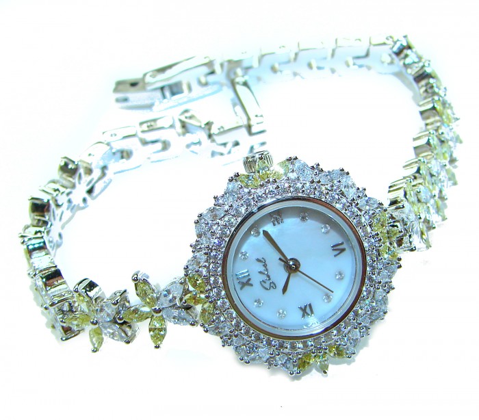 Precious 108.8 carat natural Peridot White Topaz .925 Sterling Silver handmade Bracelet - Watch - Close-up of luxury jeweled watch with diamond accents and intricate band.