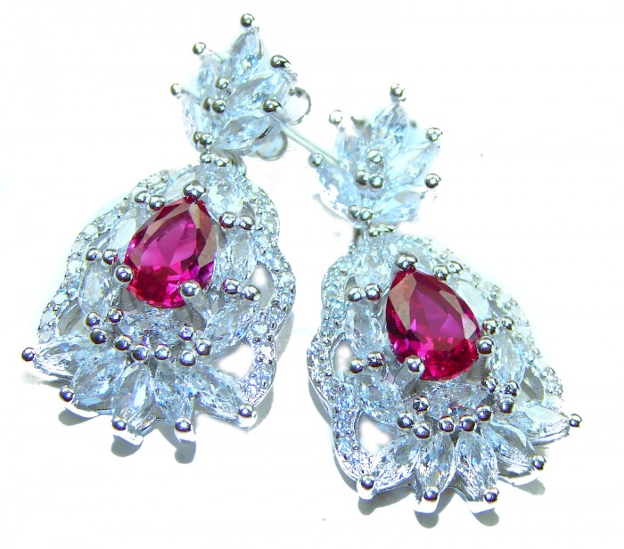Magnificent Jewel 10.5 carat Ruby .925 Sterling Silver handcrafted incredible earrings - Close-up of ruby and sterling silver earrings with intricate design