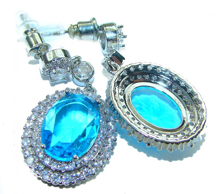 Atlantica 8.5 carat genuine Swiss Blue Topaz .925 Sterling Silver handmade Statement earrings - Close-up of blue topaz earrings with sterling silver settings.