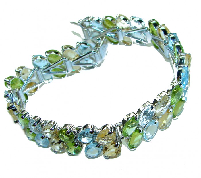 Spectacular 68.5 carat authentic Multigem .925 Sterling Silver handmade bangle Bracelet - Multigem sterling silver bracelet, angled view showing gemstones.