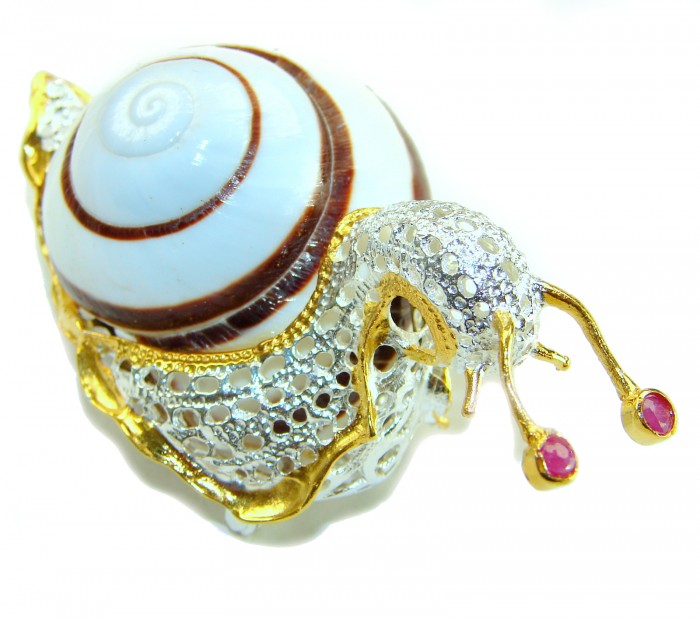 LARE Snail - Ocean Shell 18k Gold over .925 Sterling Silver handcrafted Pendant Brooch - Snail jewelry, angle view, shell with gold and silver details, ruby accents.