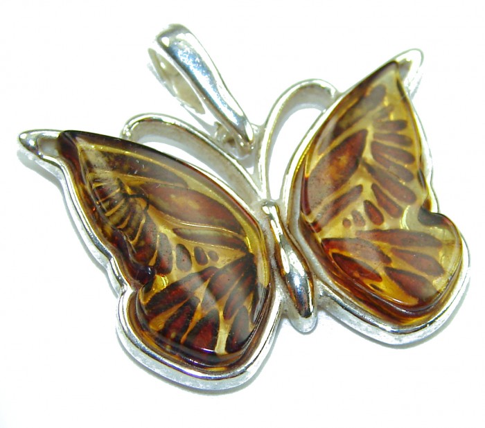 Cute Butterfly Authentic carved Baltic Amber .925 Sterling Silver handcrafted pendant - Butterfly pendant, carved Baltic amber, sterling silver, top view.
