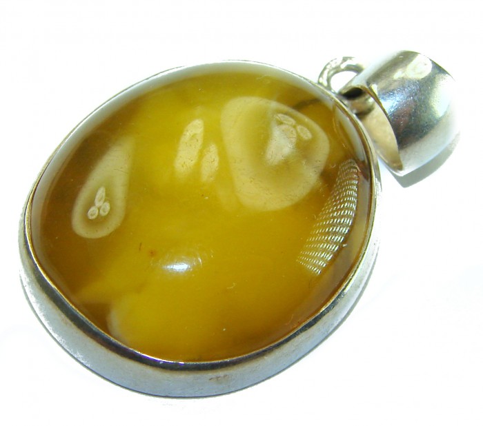 Prehistoric Authentic Baltic Amber .925 Sterling Silver beautifully handcrafted Pendant - Close-up of Baltic amber pendant with silver setting.
