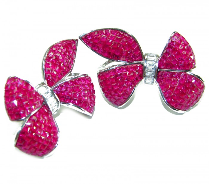 Magnificent Jewel - Bow - mystery setting 25.5 carat Ruby .925 Sterling Silver handcrafted incredible earrings - Top view of bow-shaped ruby earrings with mystery setting.