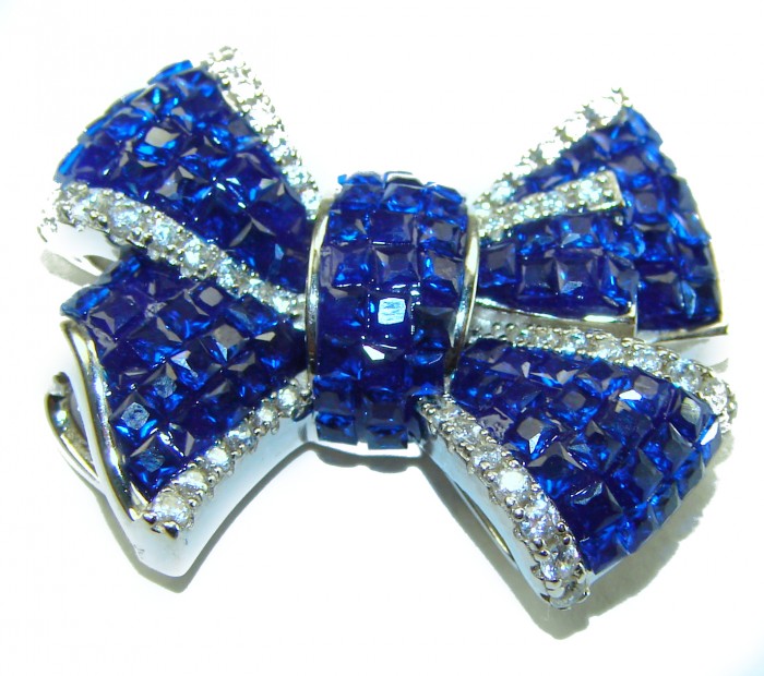 Heirloom blue Bow Genuine 17.5 carat Sapphire .925 Sterling Silver handmade Pendant - Blue sapphire bow brooch, close-up, with sterling silver details.