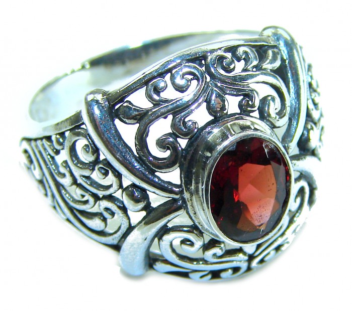 4.5 carat oval cut Red Garnet .925 Sterling Silver handcrafted ring; s. 9 - Close-up of 4.5 carat oval cut red garnet in ornate sterling silver setting.