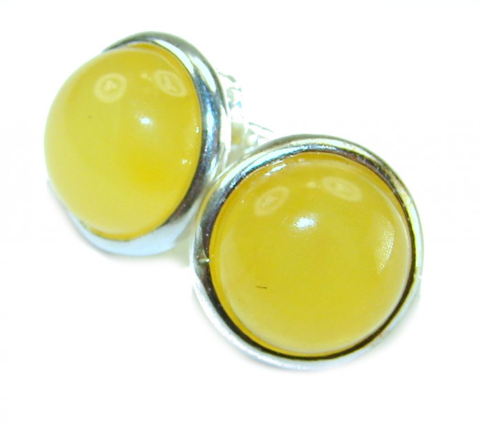 Natural Amber .925 Sterling Silver handmade earrings - Close-up of natural amber earrings in silver setting.