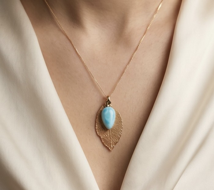 Stylish REAL Leaf dipped in copper 14.5 carat Larimar .925 Sterling Silver and Copper Pendant - Necklace with leaf pendant and blue stone, shown worn on neckline.