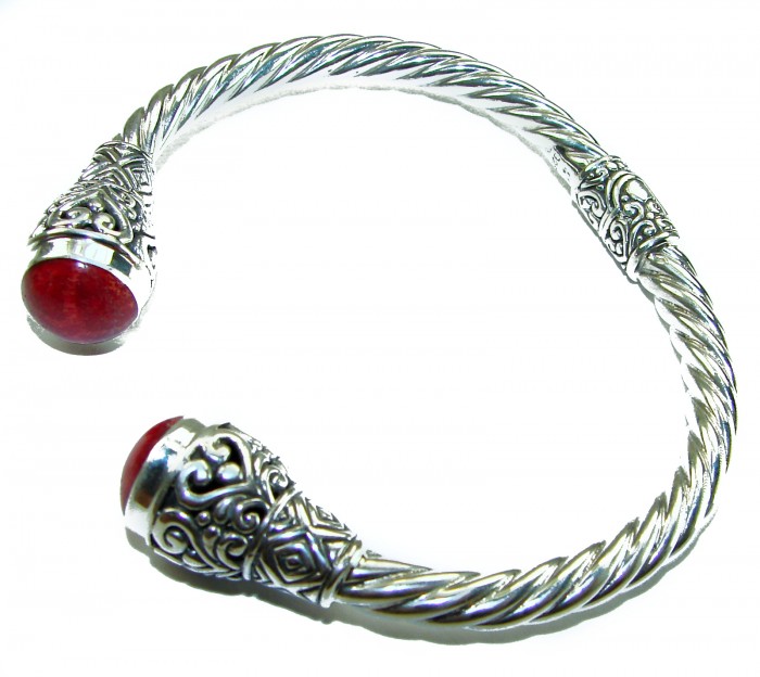 10.5 carat Fossilized Coral .925 Sterling Silver handcrafted Statement Bali made Bracelet - Sterling silver bracelet with red fossilized coral, top view.