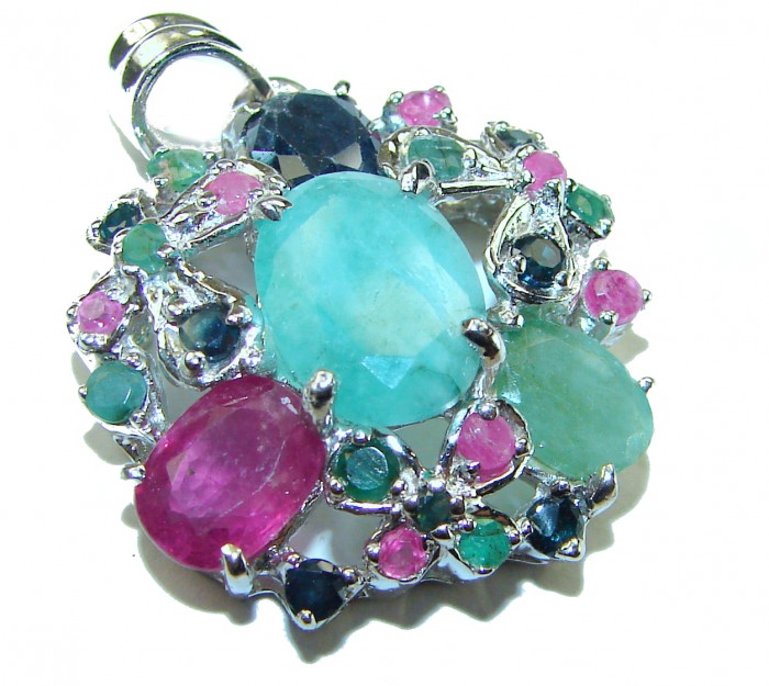 Spectacular 12.8 carat authentic Colombian Emerald .925 Sterling Silver handcrafted Pendant - Close-up of colorful gemstone pendant with emerald centerpiece.