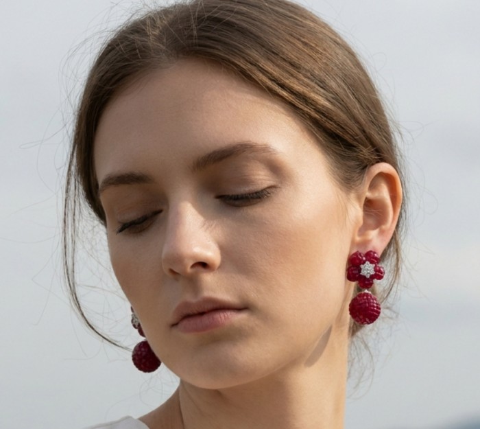 Giovanna - Authentic mystery setting 45.9 carat Ruby .925 Sterling Silver handcrafted earrings - Woman wearing 45.9 carat ruby earrings, side view.