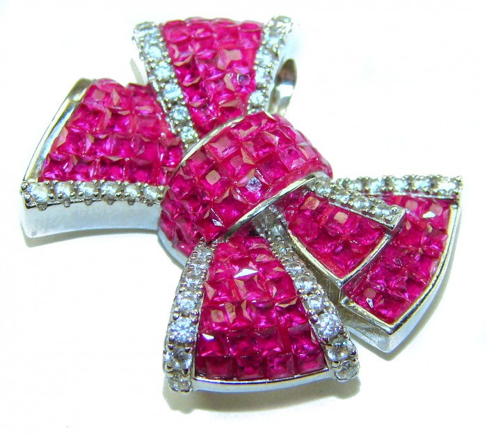 Heirloom blue Bow Genuine 17.5 carat Ruby .925 Sterling Silver handmade Pendant - Close-up of heirloom bow-shaped ruby and diamond pendant.