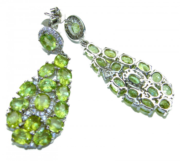 Fiesta Authentic 27.5 carat Peridot .925 Sterling Silver brilliantly handcrafted Statement earrings - Close-up of Peridot and sterling silver earrings, front and back views.