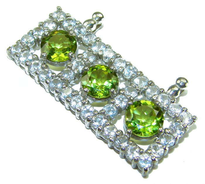 Mystery 22.6 carat Green Peridot .925 Sterling Silver handcrafted pendant - Close-up of green peridot stones in sterling silver setting.