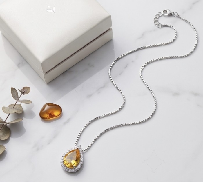 Angel Whisper Necklace ~ 9.7 Ct Yellow Sapphire Necklace In 925 Sterling Silver necklace - Yellow sapphire necklace with box on marble background, top view.