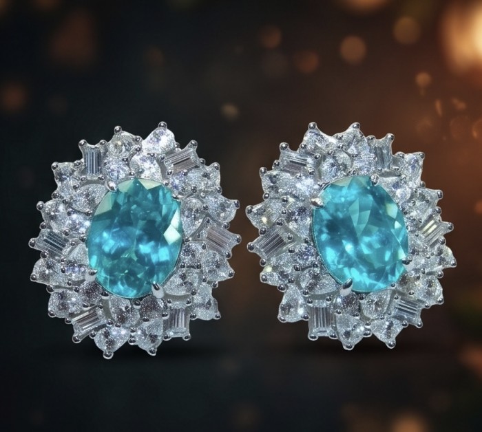 Royalty oval cut 5.2 carat Paraiba Tourmaline .925 Sterling Silver entirely handmade earrings - Close-up of oval cut Paraiba Tourmaline earrings with diamonds.
