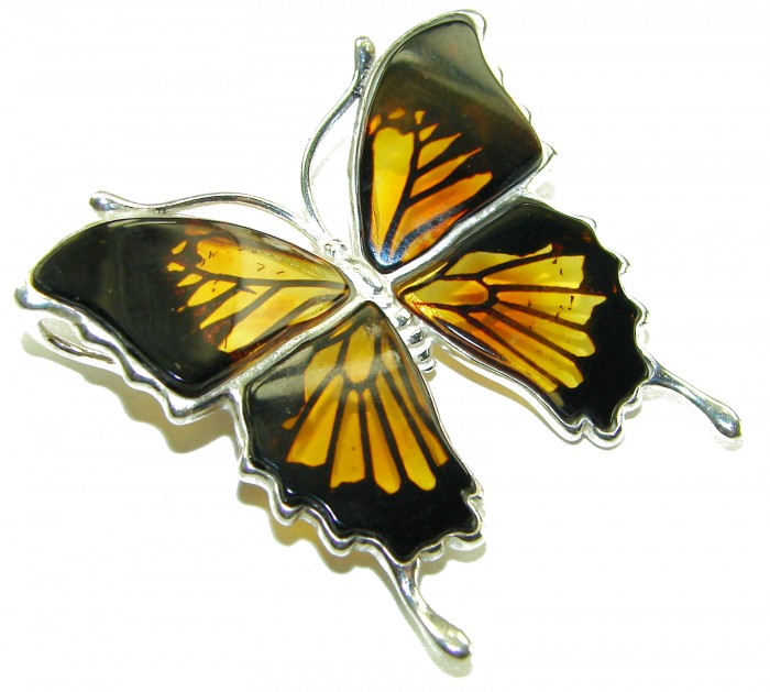 Large Golden Butterfly carved Baltic Polish Amber .925 Sterling Silver handcrafted Pendant / Brooch - Top view of Baltic Amber butterfly brooch in silver setting.