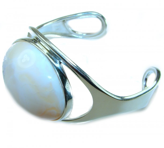 Full of Secrets 125.5 carat Genuine Mexican white Fire Opal handcrafted .925 Sterling Silver Bracelet / Cuff - Side view of silver bracelet with Mexican white fire opal stone.