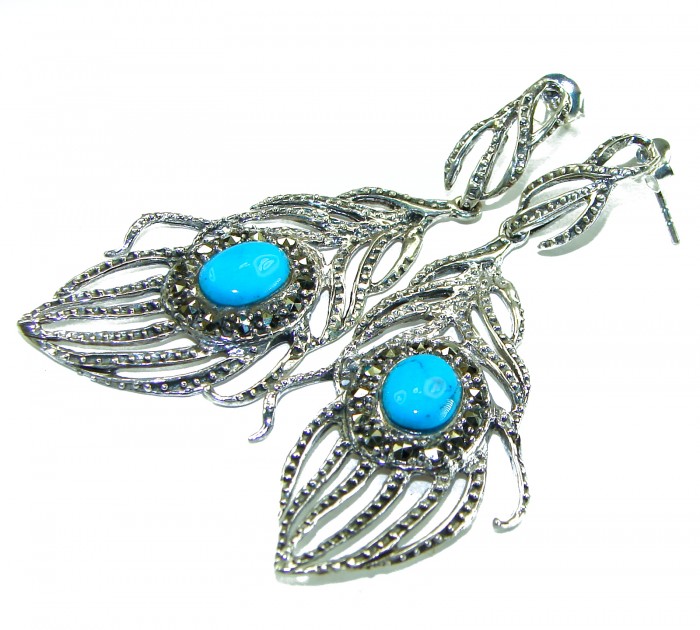 Great Peacocks Feathers authentic inlay Turquoise .925 Sterling Silver handcrafted Earrings - Side view of peacock feather earrings with turquoise stones.