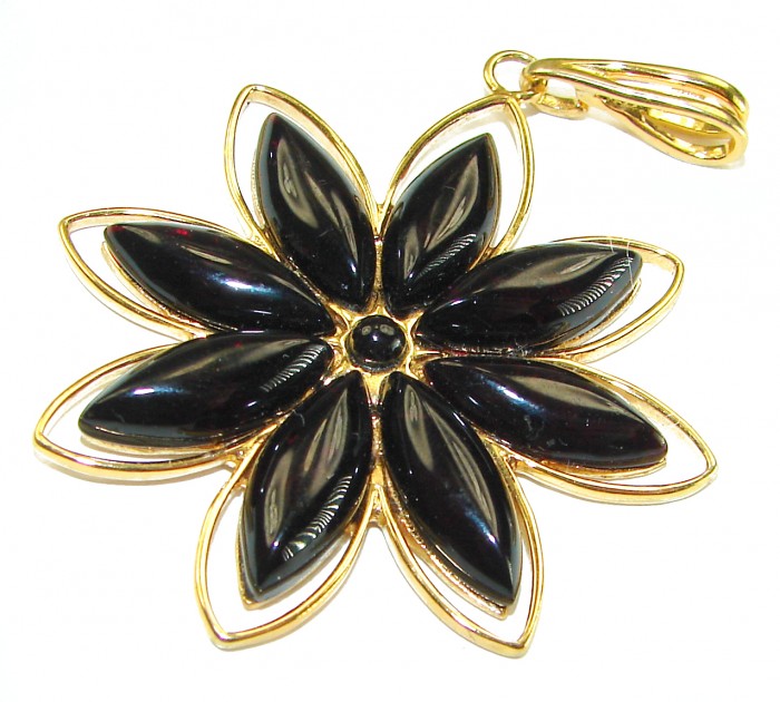 Prehistoric cognac Authentic Baltic Amber 18K Gold over .925 Sterling Silver beautifully handcrafted Pendant - Flower-shaped amber pendant, gold accents, top view.