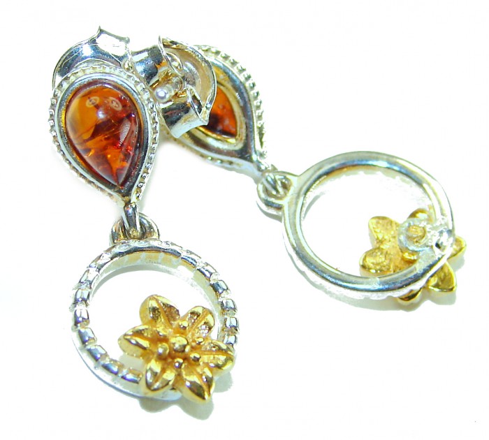 Baltic Amber 2 tones .925 Sterling Silver entirely handcrafted earrings - Close-up of Baltic Amber earrings, sterling silver with gold flower accents.