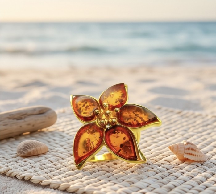 Golden Flower Authentic Baltic Amber 18K Gold over .925 Sterling Silver handcrafted ring; s. 7 adjustable - Golden flower Baltic amber ring on beach mat with seashells.