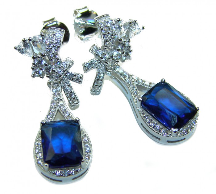 Pear cut 4.5 carat Sapphire .925 Sterling Silver handcrafted incredible earrings - Close-up of sapphire and diamond sterling silver earrings.