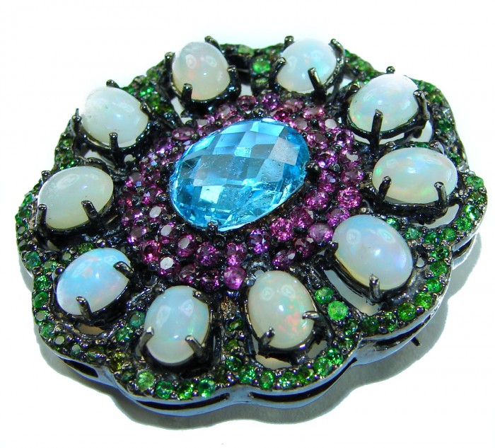 Costa del Sol oval cut 27.8 carat Ethiopian Opal Swiss Blue Topaz .925 Sterling Silver Handcrafted Pendant - Close-up of Costa del Sol brooch featuring opals and Swiss Blue gemstone