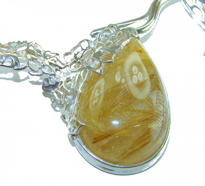 Incredible Design Golden Rutilated Quartz .925 Sterling Silver handcrafted necklace - Golden rutilated quartz pendant close-up with intricate silver design.