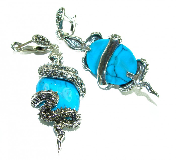 Great authentic inlay Turquoise .925 Sterling Silver handcrafted Earrings - Turquoise earrings with snake design in silver, angled view.