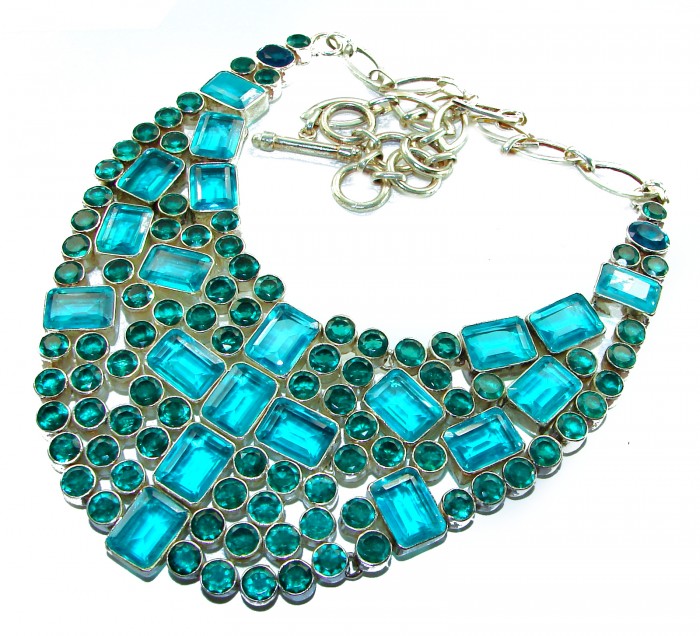 Lavishly Abundant - Holy Cross 165.5 grams lab. Paraiba Tourmaline .925 Sterling Silver handcrafted necklace - Close-up of turquoise necklace with rectangular and round stones.