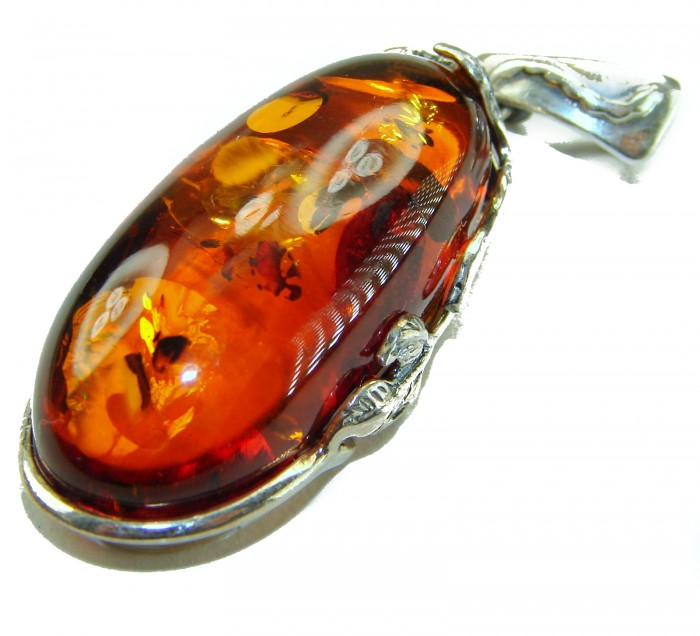 Prehistoric Authentic Baltic Amber .925 Sterling Silver beautifully handcrafted Pendant - Close-up of Baltic amber pendant with sterling silver setting.