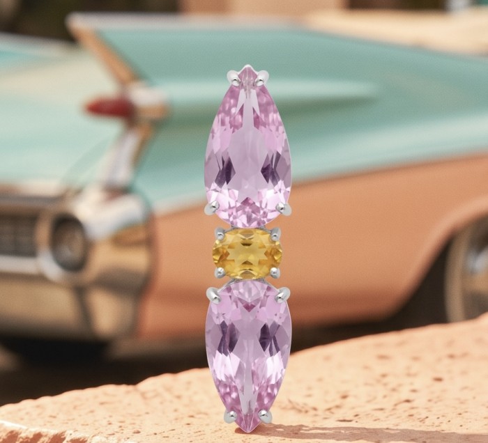 Incredible pear cut 15.8 carat Pink Topaz Rhodium over .925 Sterling Silver handcrafted pendant - Pink topaz earring against vintage car background, front view.