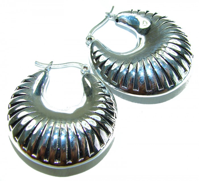 Highly Polished Fancy Modern design .925 Sterling Silver Italy made Earrings - Close-up of polished silver earrings with textured design.