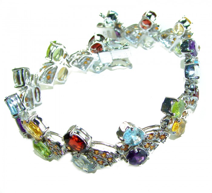 One of the kind 48.5 carat genuine Multigem Rhodium over .925 Sterling Silver Bracelet - Multigem rhodium bracelet, angled view showing colorful stones.