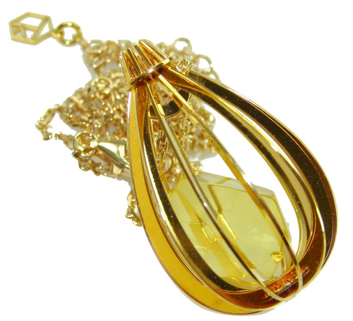 Wonderland Elegant Genuine Baltic Amber 22K Gold over .925 Silver handcrafted Necklace - Gold Baltic amber pendant close-up with chain detail.