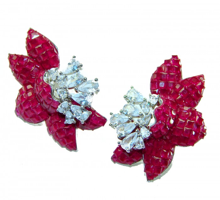 Magnificent Jewel 15.5 carat Ruby .925 Sterling Silver handcrafted incredible earrings - Earrings with rubies and diamonds close-up on white background
