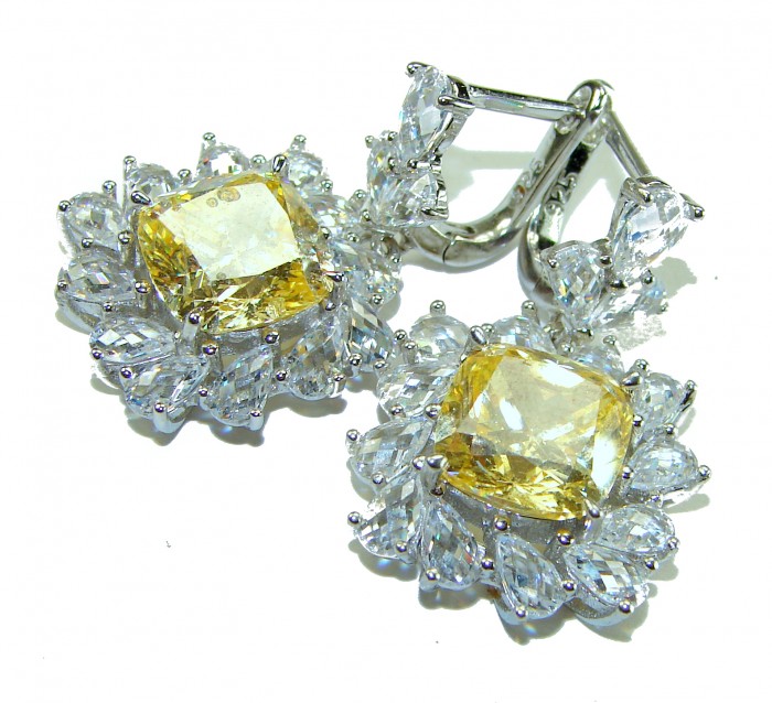 15.5 carat Golden - yellow Montana Sapphire .925 Sterling Silver handcrafted earrings - Yellow sapphire earrings with diamond halo, front view.