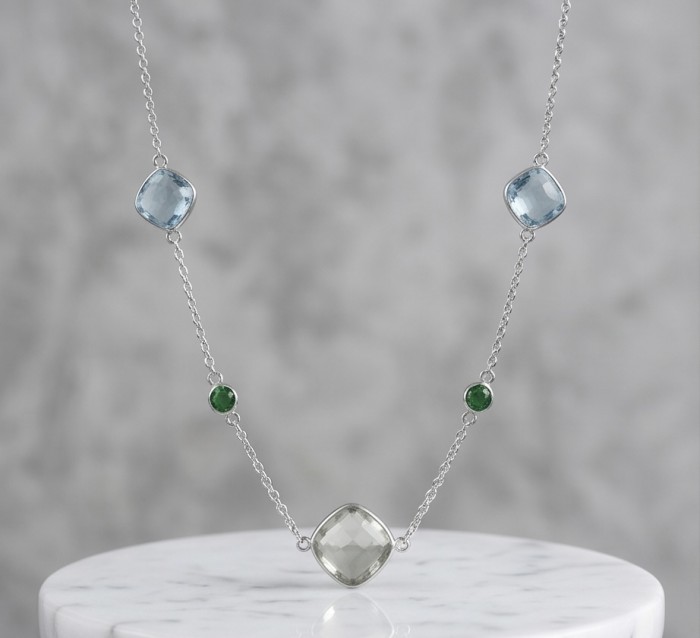Infinity 8.5 carat Authentic Multigems Rhodium over .925 Sterling Silver handcrafted Statement necklace - Front view of Infinity multigem necklace with blue and green stones.