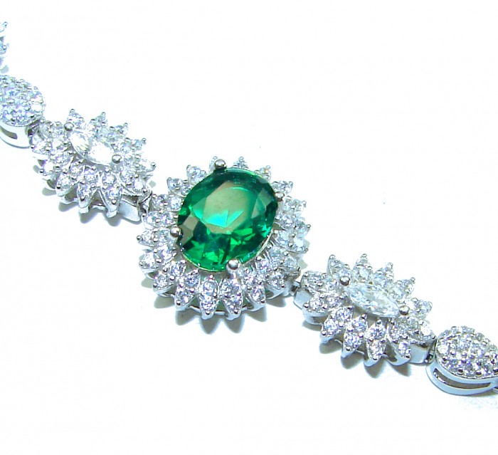 Giovanna - Authentic 6.8 carat Emerlad .925 Sterling Silver handcrafted Statement bracelet - Emerald stone close-up with surrounding diamonds, top view.