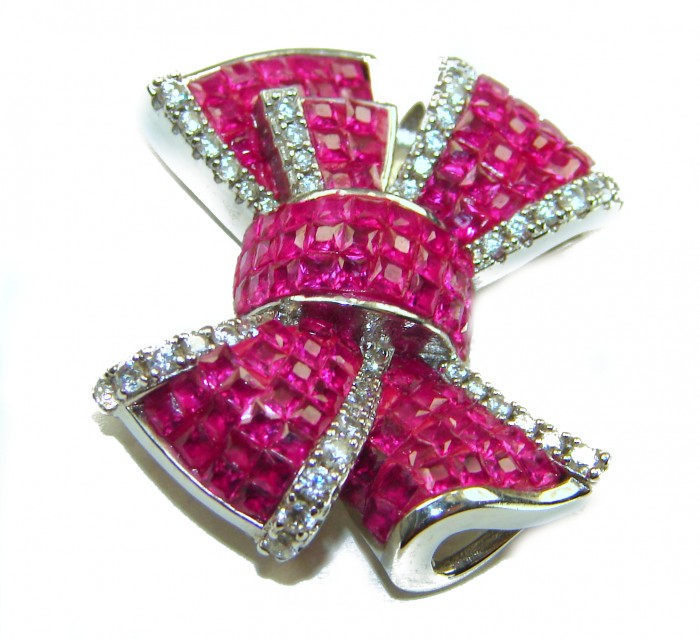 Heirloom blue Bow Genuine 17.5 carat Ruby .925 Sterling Silver handmade Pendant - Ruby bow brooch with diamond accents, top angle view.