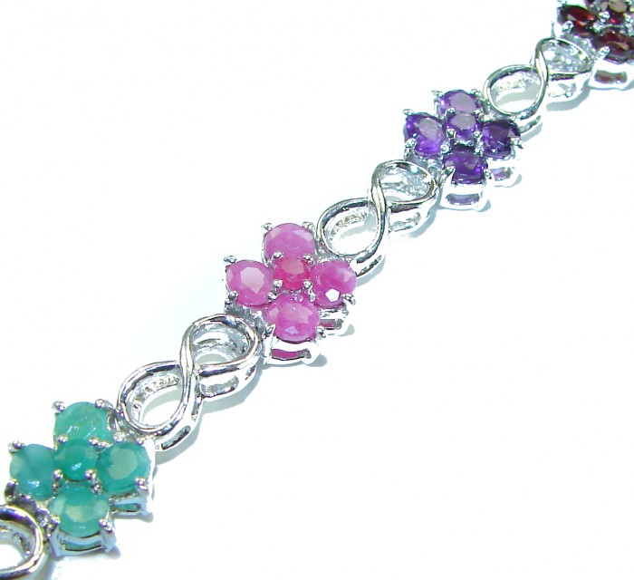Gabriella 25.5 carat Genuine Ruby Emerald Sapphire .925 Sterling Silver handcrafted Bracelet - Close-up of multi-gemstone floral bracelet with infinity links