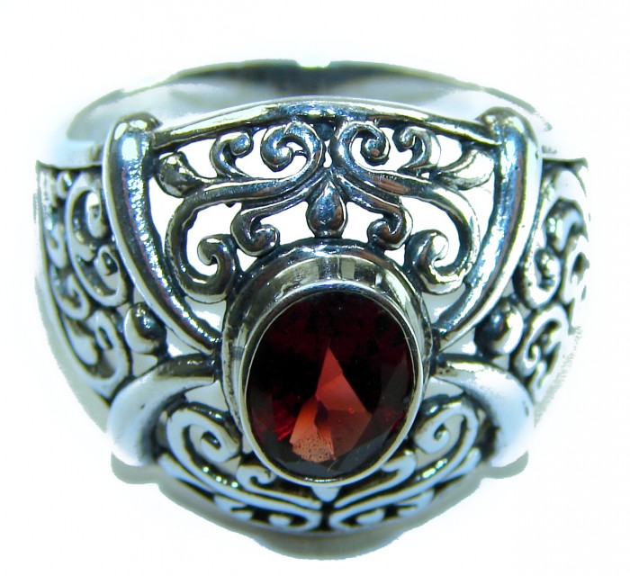 4.5 carat oval cut Red Garnet .925 Sterling Silver handcrafted ring; s. 9 - Ornate silver ring with red garnet, frontal close-up view.