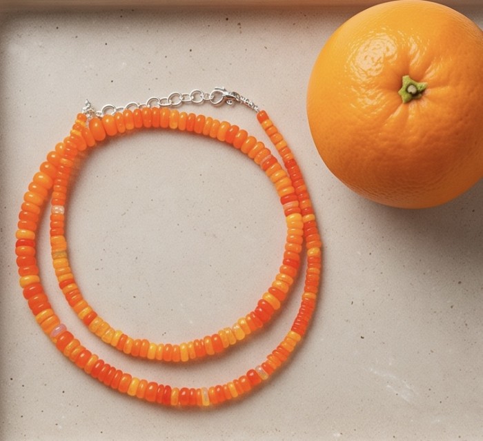 Mystery 11.2 carat Australian Orange Opal .925 Sterling Silver .925 Sterling Silver Statement Necklace - Orange opal necklace with sterling silver clasp next to an orange.