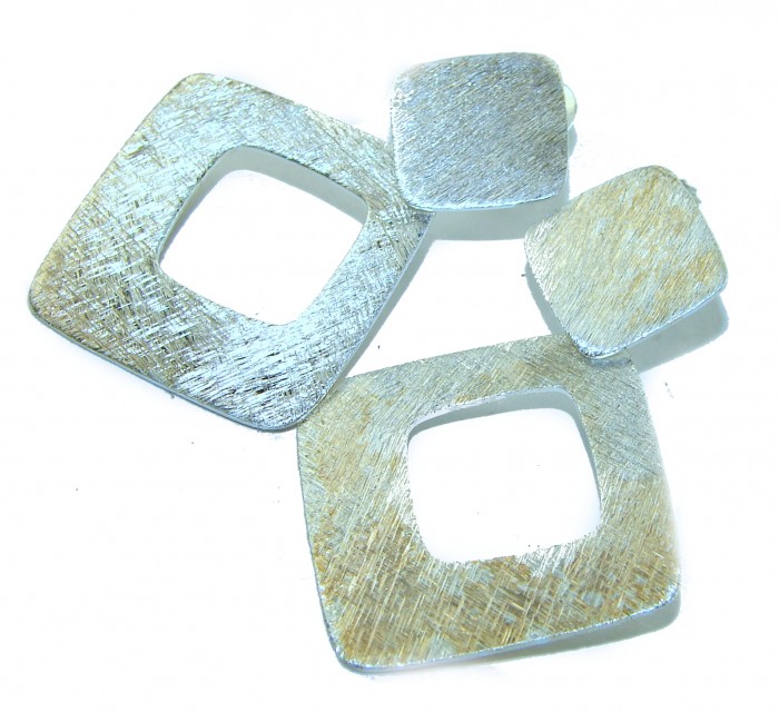 Fancy .925 Sterling Silver Italy made Earrings - Close-up of geometric sterling silver earrings with brushed texture.